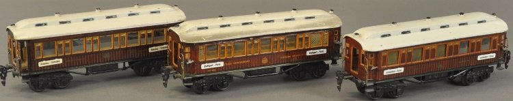 MARKLIN INTERNATIONAL 'O' GAUGE TRAIN CARS: Germany, lot includes three cars, Sleeping car, Dining car, and additional Dining car, each with city placard on side, eight wheels, brown with white roofs. 10 1/4" l.