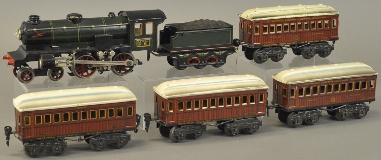 MARKLIN 'O' GAUGE TRAIN SET: Germany, 4-4-0 steam type electric driven locomotive done in green body with six wheel tender, together with four eight wheel tin lithographed #1886 passenger cars, done in brown bodies and white roof