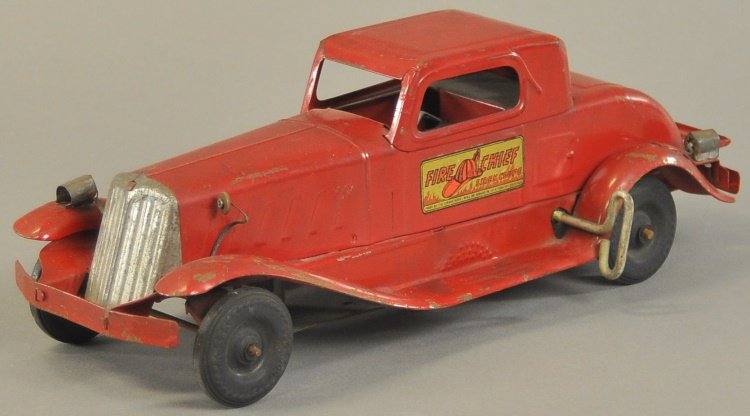GIRARD FIRE CHIEF CAR: Pressed steel, painted in red overall, clockwork driven, features electric lights, fold down rear rack, decal on door, emits siren sounds. 14" l.