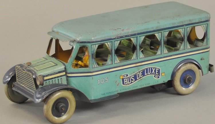 STAUSS "BUS DELUXE": Lithographed tin, colorful blue color scheme, great curtain window visuals, clockwork driven, seated driver. 13 1/2" l.