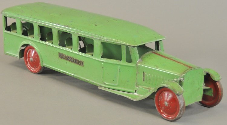 STEELCRAFT "INTER-CITY" BUS: c. 1929, pressed steel, painted in green overall, red painted steel disc wheels, decals on sides, bench seats pressed at windows. 25" l.