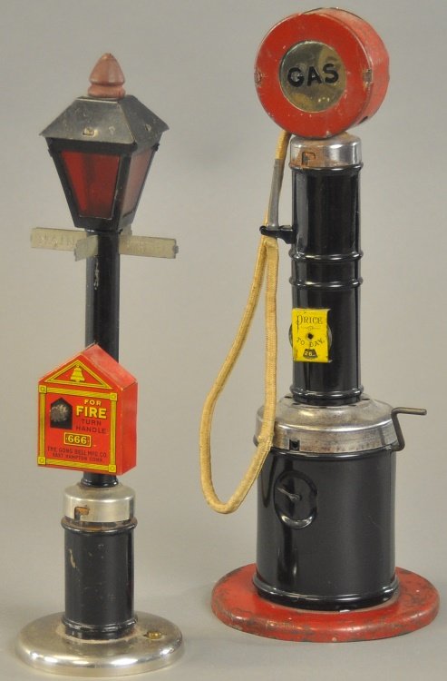 MAIN STREET FIRE BELL LAMP AND FUEL PUMP: Gong Bell, lithographed tin lamp post with fire box, emits bell sounds when cranked, together with large tin gas pump with crank activating bell ringer sound. Approx. 12" l.
