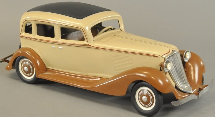 COR COR GRAHAM SEDAN: Pressed steel, painted in tan body with brown fenders, features on/off switch for headlights, spare on trunk, nickel grille. 20" l.