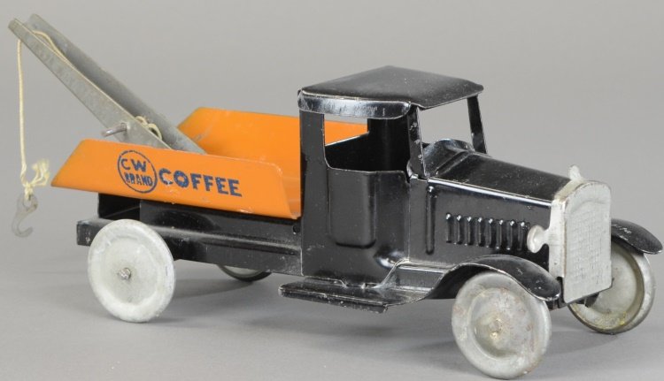 METALCRAFT "C. W. COFFEE" DUMP TRUCK: 1930's, pressed steel, cab painted in black, reads, C. W. Brand Coffee," disc wheels. 11 1/2" l.
