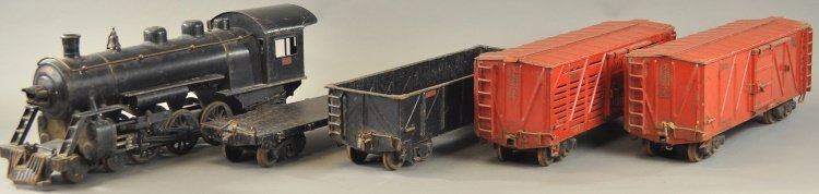 BUDDY 'L' OUTDOOR RAILROAD LOCO & CARS w/TRACK: Pressed steel, lot of familiar oversized outdoor toys includes: locomotive, flat car, stock car, box car, and gondola. 21" - 27" l.
