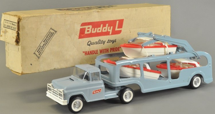BOXED BUDDY 'L' SELF LOADING BOAT HAULER #5466: Scarce truck, pressed steel with three plastic boats on board, painted in blue and decaled, rubber tires, has working lift mechanism, includes original box. 26" l.