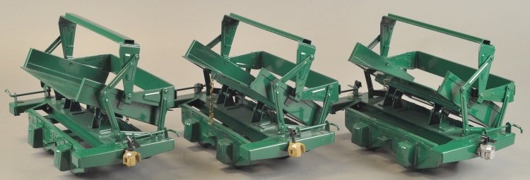 T-REPRODUCTION BUDDY 'L' SIDE DUMP CARS: Includes three contemporary, outdoor railroad accessory cars, pressed steel, each painted in green overall, and features side lifting supports. 11" l.