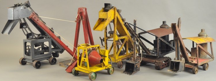 ASSORTED PRESSED STEEL OUTDOOR TOYS: Lot includes: Buddy 'L' Steam Shovel on treads, grey and yellow Sand Loaders, small Concrete Mixer, Steam Shovel and Kiddies Toys Collapsible Derrick. 5" - 15" l.