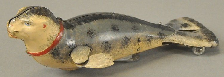 LEHMANN SEAL: Germany, lithographed tin, life like colors and scale, wind-up action, a very popular toy. 7" l.