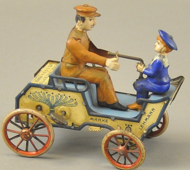 LEHMANN "NAUGHTY BOY" VIS-À-VIS: Germany, lithographed tin toy, depicts young boy attempting to take the tiller wheel away from his father's command, amusing action. 5" l.