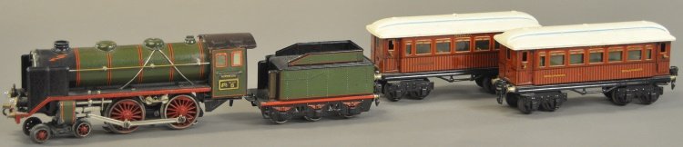 MARKLIN 'O' GAUGE MITROPA PASSENGER SET: Germany, includes a 4-4-0 electric driven steam type locomotive with six wheel tender in green, together with brown dining car and matching sleeping car, both with white roofs and interiors. 8 1/4" l.