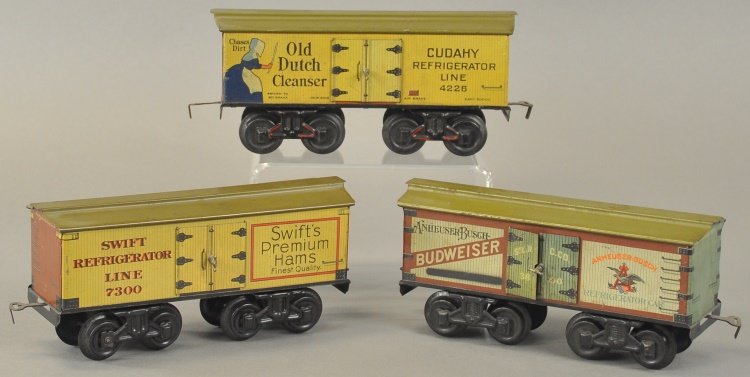 BING ADVERTISING BOX CARS: Germany, gauge '1', lithographed tin box cars, includes: "Old Dutch Cleanser," "Swift's Premium Hams" ad, and "Budweiser" logo on sides, opening side doors. 9" l.