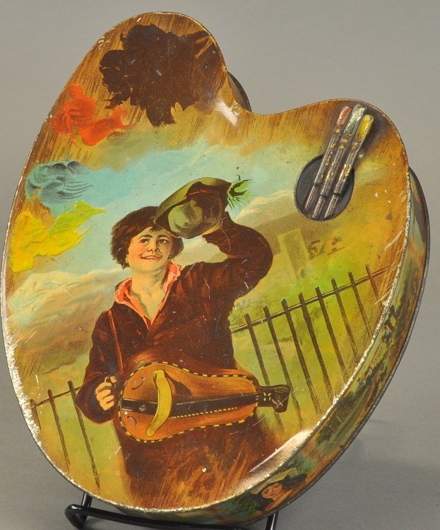 ARTIST'S PALLET BISCUIT TIN BOX: Huntley and Palmer, England, lithographed tin with brushes, embossed at one end, great graphic image on lid. 7 1/2" w. x 2" d. x 9 3/4" h.