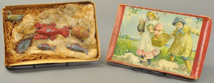 BOXED TUB TOYS SET: Hand painted tin examples, animal toys include: turtle, lobster, fish, frog and duck, paper litho scene on box lid. Box 6" x 10".