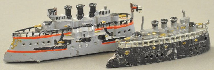 GERMAN WARSHIPS: Hand painted pot metal examples, includes three funnel ship with German ensign, flying bridge and broadside guns below deck, together with similar ship painted in black and grey, fully railed. 4" - 4