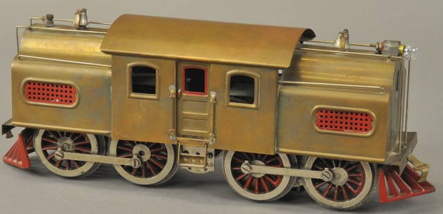 LIONEL PREWAR BRASS #54 LOCOMOTIVE: Standard gauge 0-4-4-0 electric 42" body, brass engine, red vents, bells at plate top.