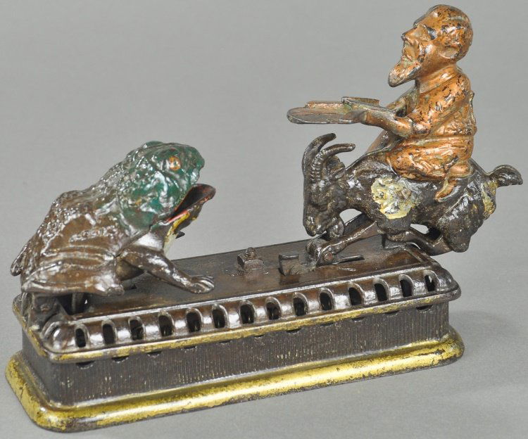 INITIATING SECOND DEGREE MECHANICAL BANK: Mechanical Novelty Works, New Britain CT, cast iron, patented 1880 Also known as “Goat, Frog and the Old Man,” an amusing casting initially named the greedy frog, quite unusual imagery with intens