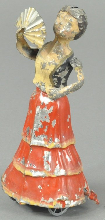 WOMAN HOLDING FAN: Germany, Gunthermann, hand painted tin figure of woman seemingly dancing in most elegant pose with fan in hand, action allows body to tilt as she dances. 7 1/2" h.