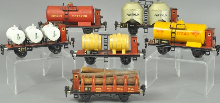 MARKLIN FREIGHT CARS: O' gauge four wheel freight cars include: Standard tank car, Coal dust car with brake-house, Shell tank car with brake-house, milk transport with brake-house, wine car transport with brake-house and s