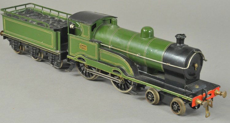 BING BASSETT-LOWKE "GEORGE V" STYLE LOCOMOTIVE: 1' gauge clockwork driven, No. 3410, green body, extensive striping, together with six wheel tender, unusual color rather than normally found in black. 13 1/2" l.