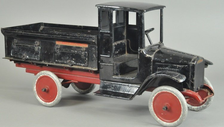 BUDDY 'L' SAND AND GRAVEL TRUCK: Enclosed black doorless cab, interesting and detailed open body features inverted "V" bottom for unloading, sides have opening, hinged doors, a true likeness and scale version of the real 1920'S work 