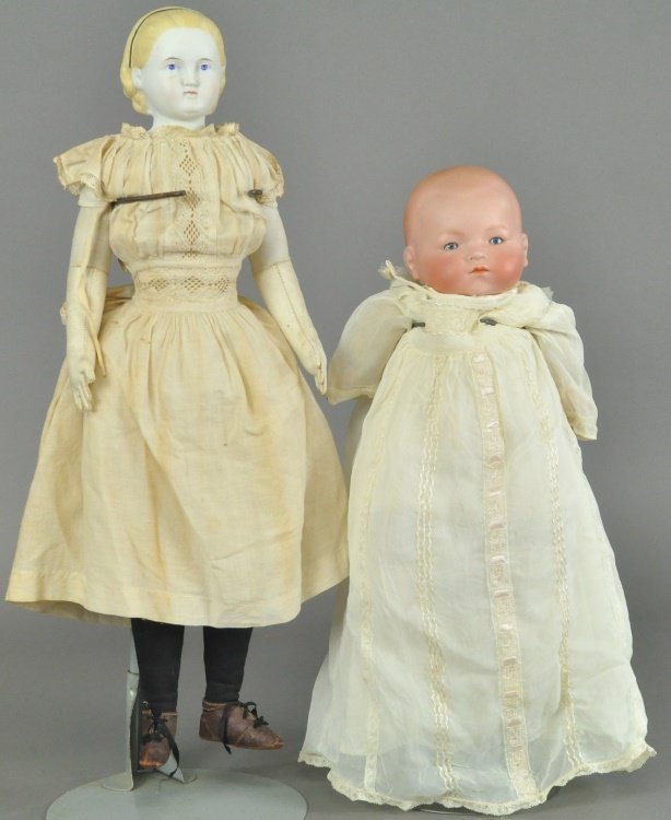 PARIAN AND BABY DOLL LOT: Rare Parian shoulder head with blond hair and black hair band on cloth body with leather forearms, and a flange neck bisque head baby doll incised "AM" with fixed blue glass eyes on a cloth body with 