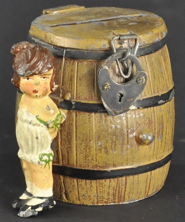 GIRL BY COIN BARREL STILL BANK: Germany, spelter example, hand painted, nicely modeled depiction of young girl posed next to barrel with key lock and coin slot at lid. 2 1/8" h.