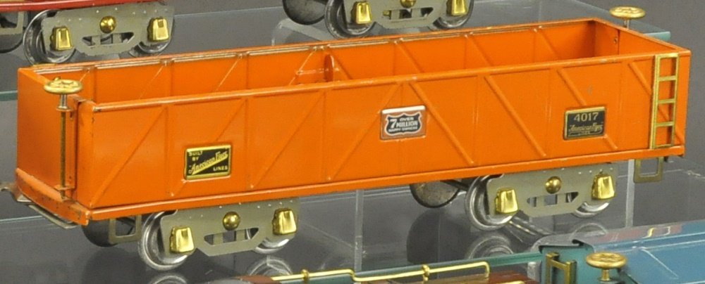 AMERICAN FLYER ORANGE SAND CAR: Pre-war wide gauge #4017 orange sand car, includes box for sand. Provenance: Jim Ferguson Collection.NOTE: Freight set was broken up into several lots