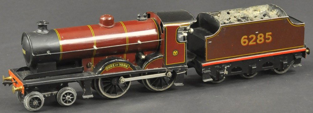 BASSETT-LOWKE "DUKE OF YORK" 4-4-0 LOCOMOTIVE: O gauge, clockwork driven, maroon body, decal on sides with six wheel tender marked "6285." 15 1/2" l.