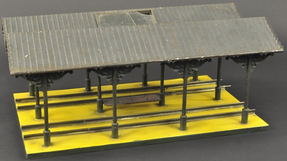 BING STATION FOR I GAUGE: Hand painted covered platform, ribbed canopy cover, ornate support posts, yellow painted base, bench at center, quite impressive detailing. 19" overall length.