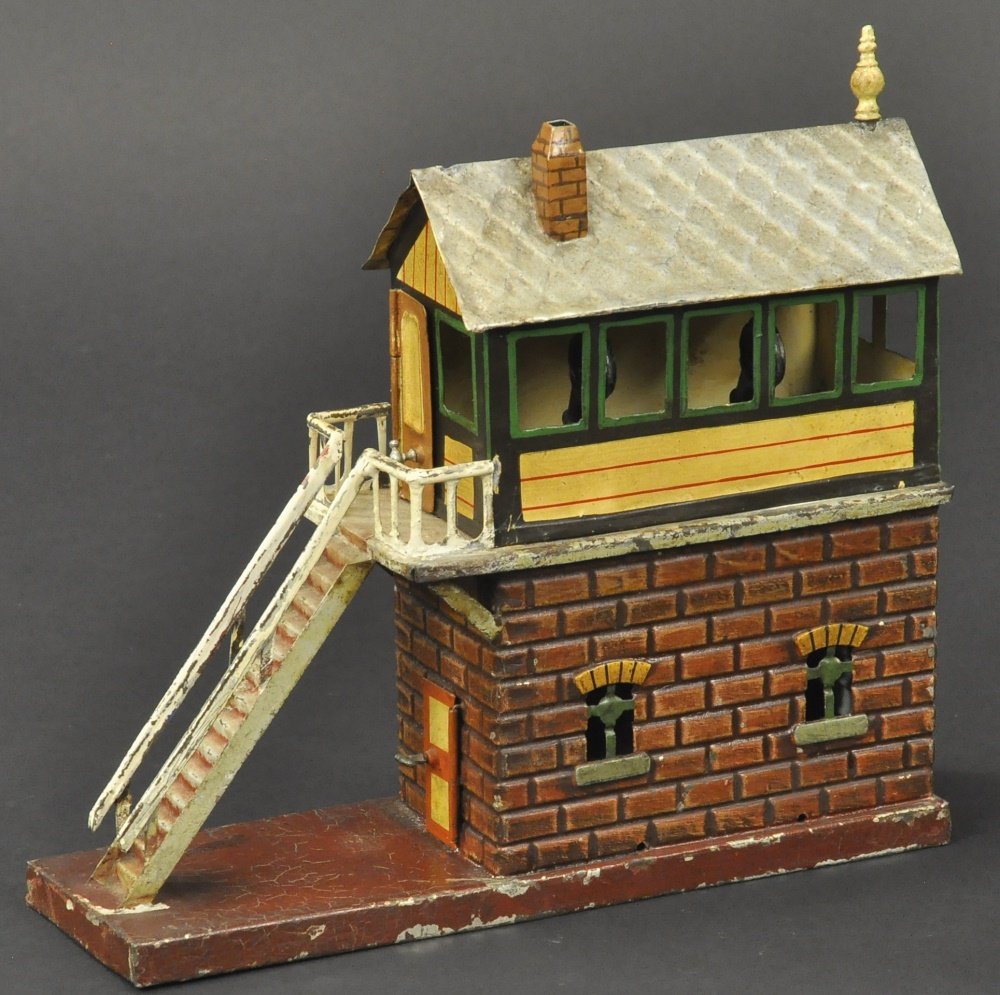 MARKLIN O GAUGE SWITCH TOWER: Germany, early hand painted example, embossed brick pattern lower level, second floor has windows and small platform from step area, two switches revealed inside opening lower level door, well detaile