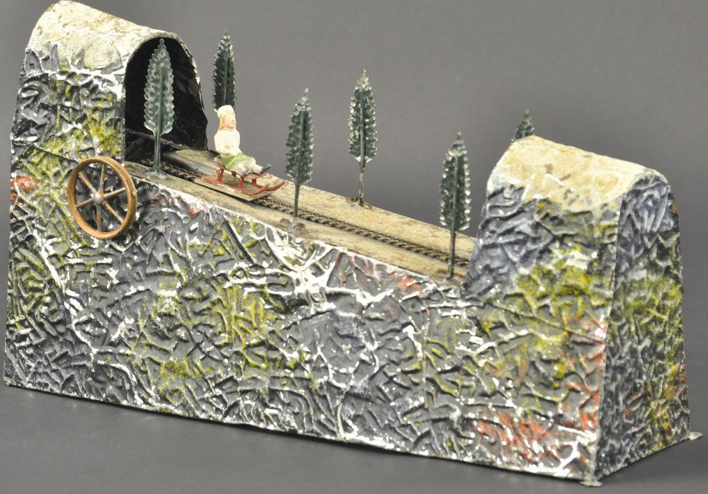 CHILDREN ON DOWNHILL SLED SLOPE (1 of 2)