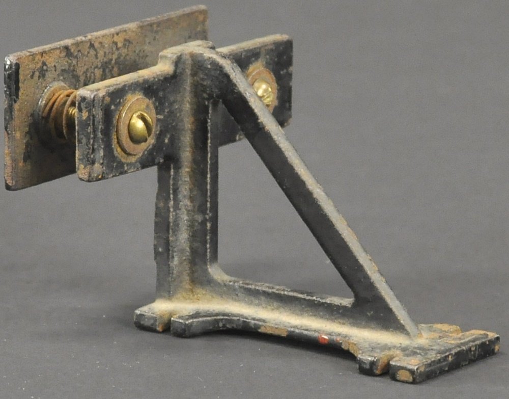 VOLTAMP TRACK BUMPER: Cast iron with spring action, elusive accessory, painted in black. 3 3/4" l.