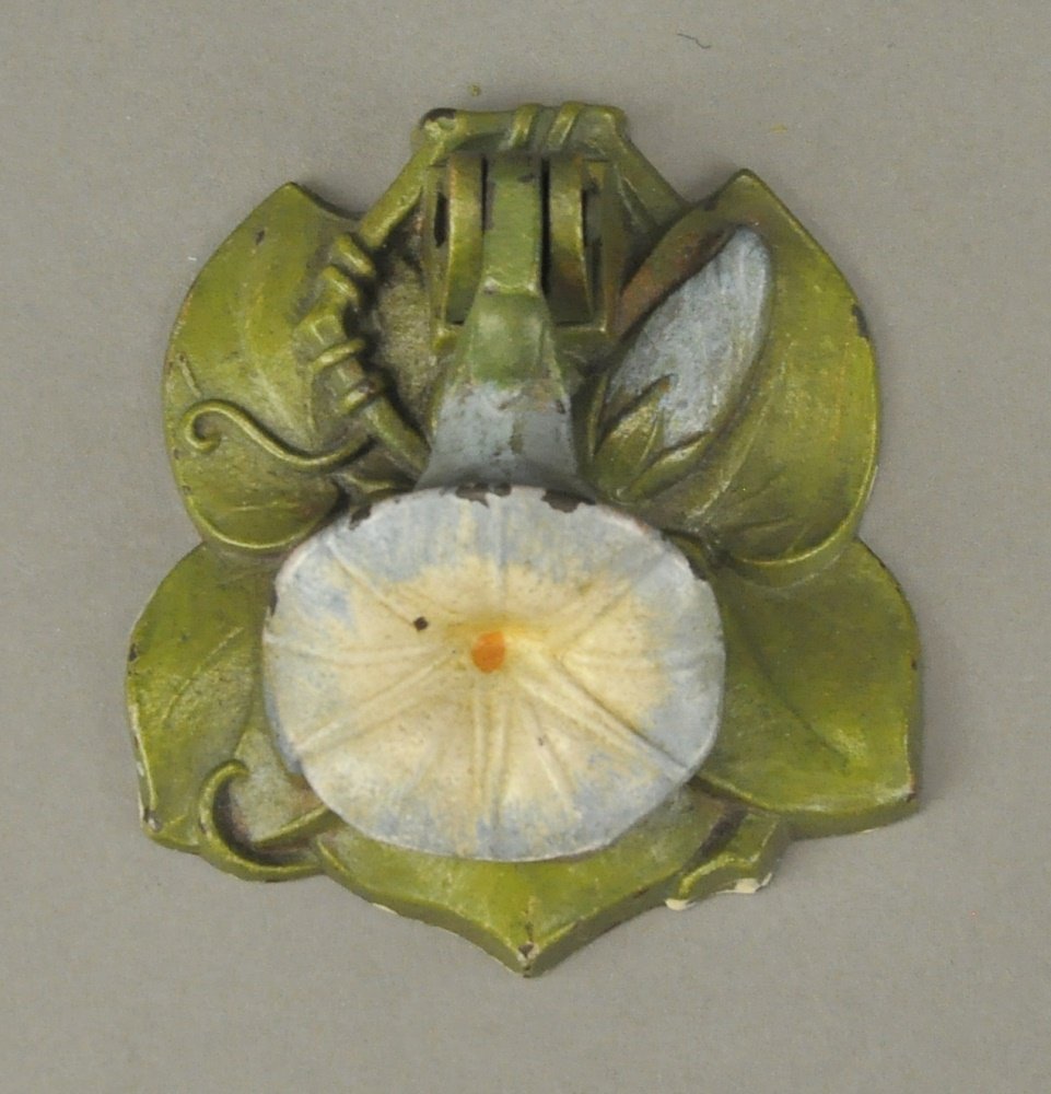 MORNING GLORY DOORKNOCKER: Judd Co., beautifully detailed doorknocker depicts single bloomed blue and white flower on green foliage on closed bud base, clever design. 3 1/4" h.