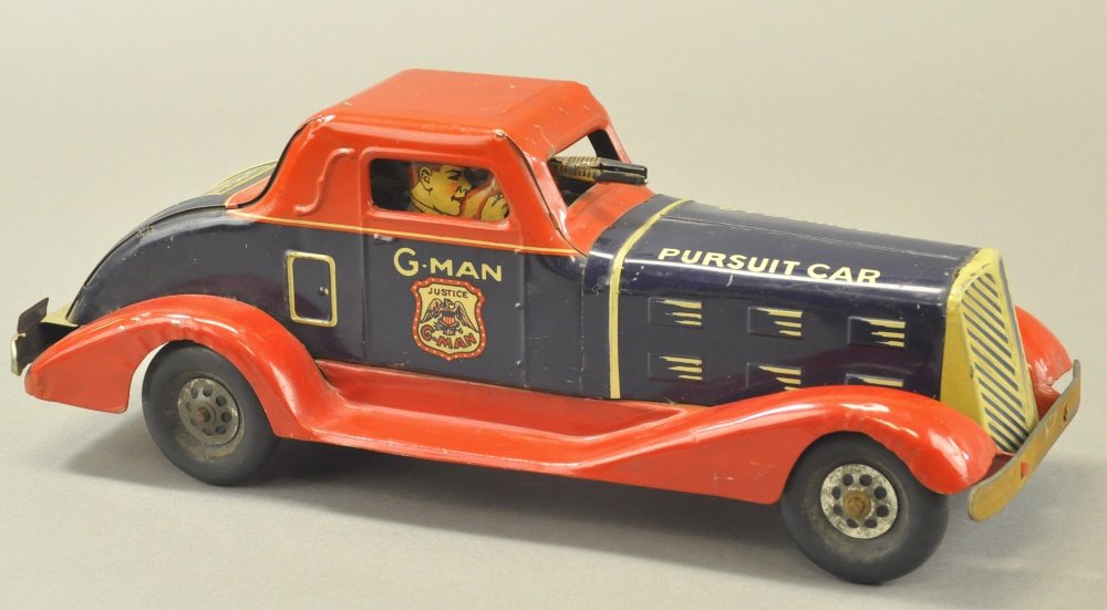 MARX G-MAN CAR: Lithographed tin, well styled blue body, red roof & fenders, features figure holding gun through windshield, friction driven. 14 1/2" l.