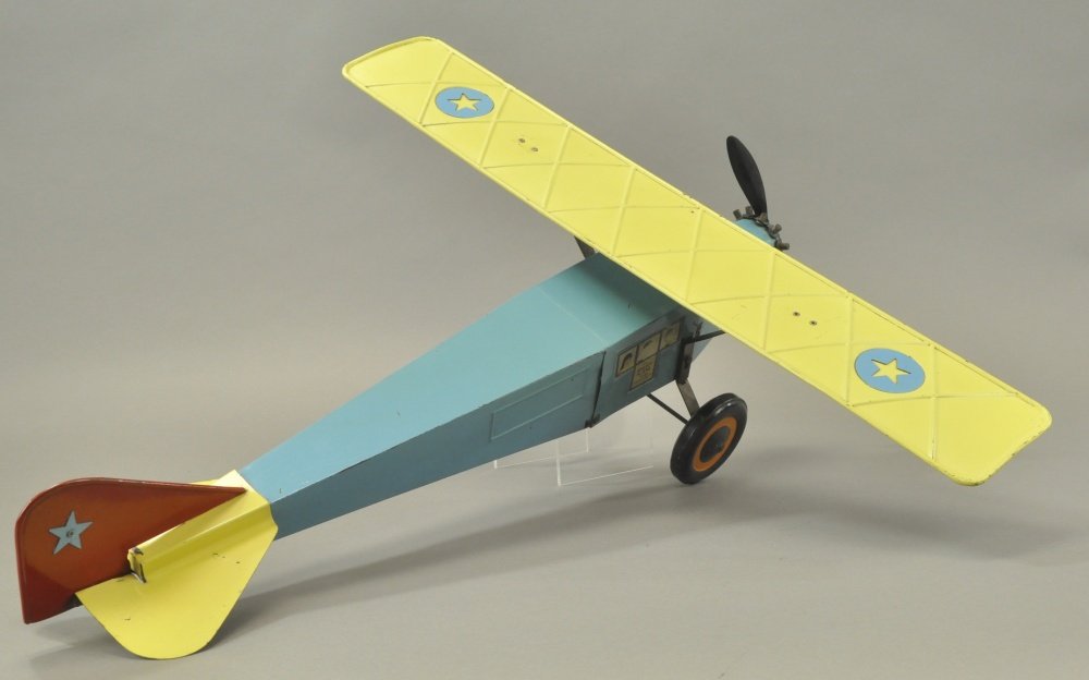 SCHIEBLE 'RIGHT PLANE': Light pressed steel, done in blue fuselage, yellow wing and prop, disc wheels, nice graphics on sides, good scale. 27" wing.