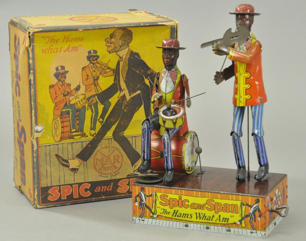 SPIC & SPAN WITH BOX: Louis Marx, lithographed tin, depicts two minstrels, one playing cymbals and drums, and the other on the fiddle, great action, well detailed toy. 6 1/2" w.