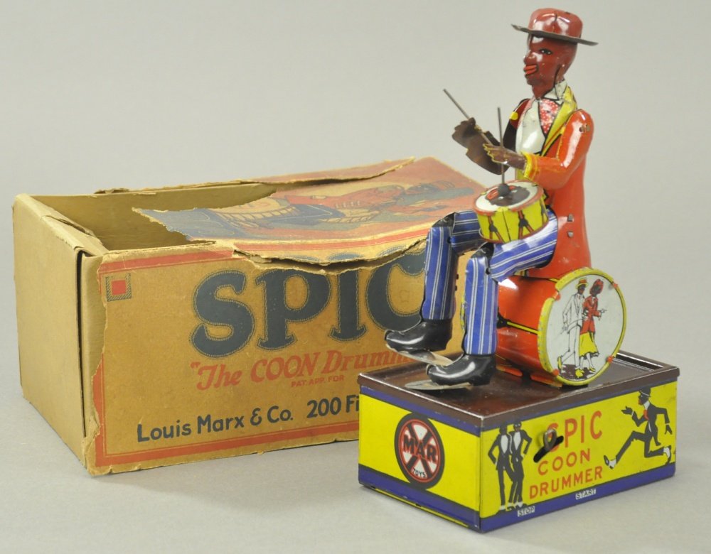SPIC COON DRUMMER w/BOX: Litho tin wind-up toy, working. It is actually a bit harder to find than the two man band toy and not as well known. Multiple actions. 8 1/2" h.