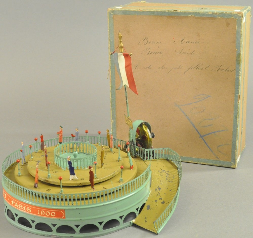 BOXED TROTTOIR ROULANT (MOVING SIDEWALK) TABLE TOY: France, label reads "Paris 1900", very early hand painted tin circular two tiered "Moving Sidewalk" walking track w/figures on both levels, flywheel allows extended revolutions when string wind is pul