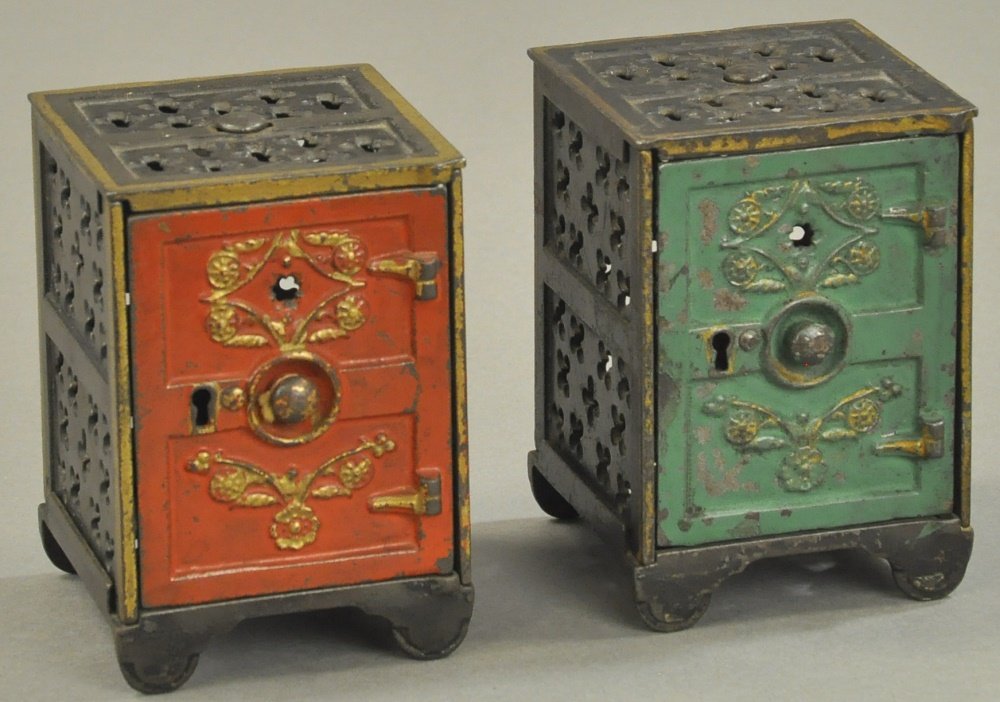 PAIR OF ORNATE TWO-PANEL SAFE STILL BANKS (1 of 2)