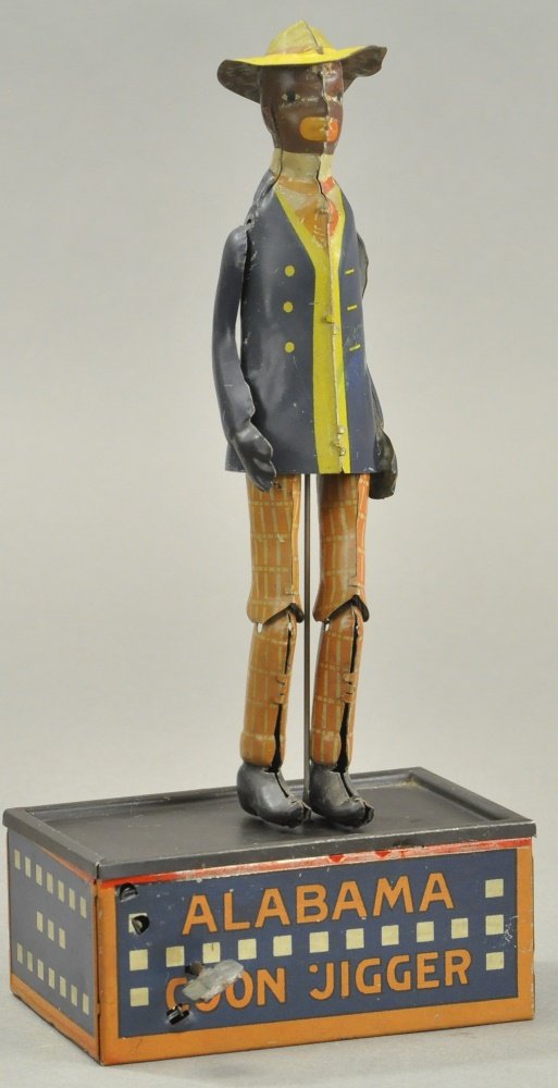 STRAUSS ALABAMA COON JIGGER: Germany, lithographed tin, popular dancer on platform, clockwork mechanism. 10 1/2" h.