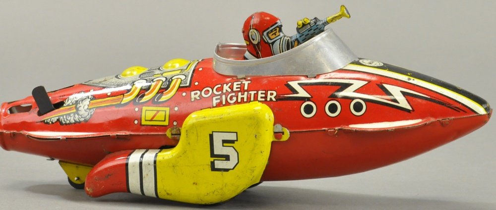 MARX FLASH GORDON ROCKET FIGHTER: Louis Marx, lithographed tin, great graphics overall, depicts Flash Gordon holding gun while seated in cockpit, clockwork driven. 12" h.