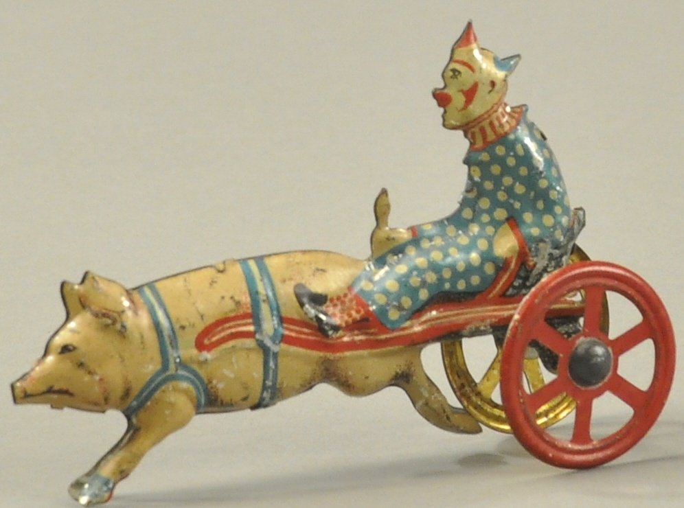 CLOWN AND PIG PENNY TOY: Germany, scarce, lithographed tin, circus themed toy with clown riding cart while holding the pig's tail. 3.75" l