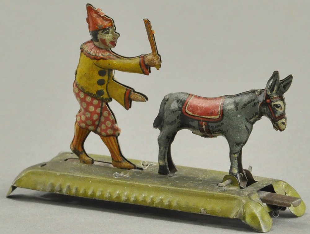 CLOWN CHASING DONKEY PENNY TOY (1 of 2)