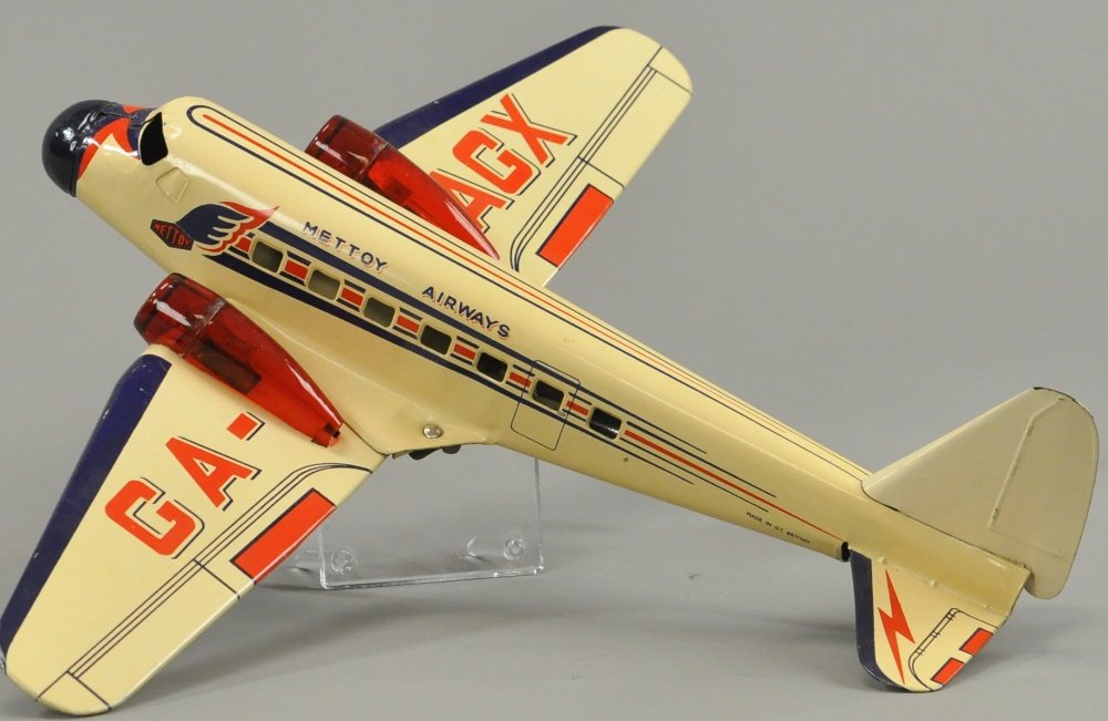 METTOY DOUGLAS DC2 AIRWAYS: Similar airplane done in soft yellow with red and blue accents, wings read GA-AGX. 21" wingspan.