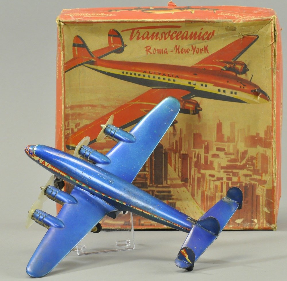 INGAP ROME TO NY AIRPLANE WITH BOX: Transoceanic four-prop airplane, done in blue overall with white striping on sides, colorful lithography appears on lid of box. 15" wingspan.