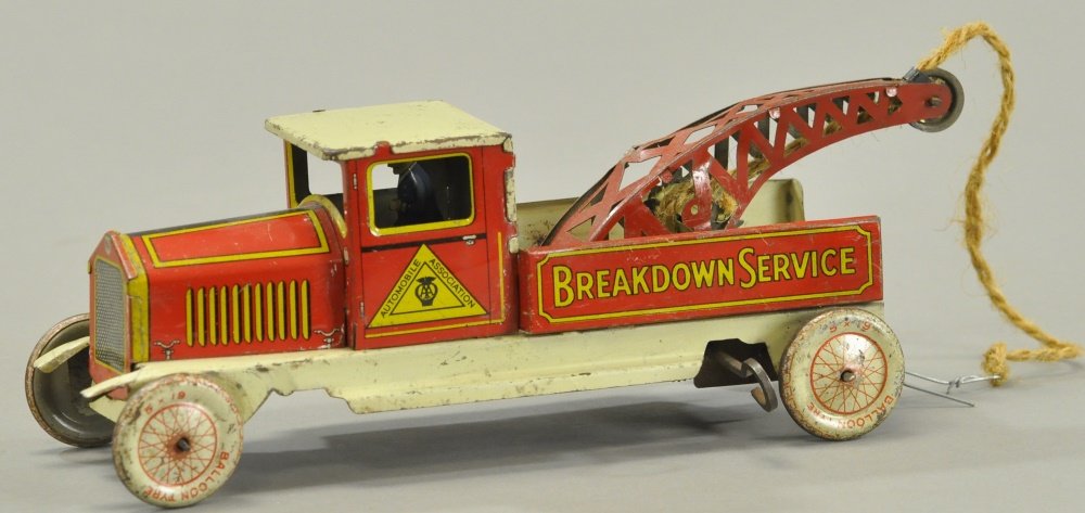 BREAKDOWN SERVICE WRECKER: England, lithographed tin, clockwork driven, driver at wheel, lithographed balloon wheels. 9 1/2" l.
