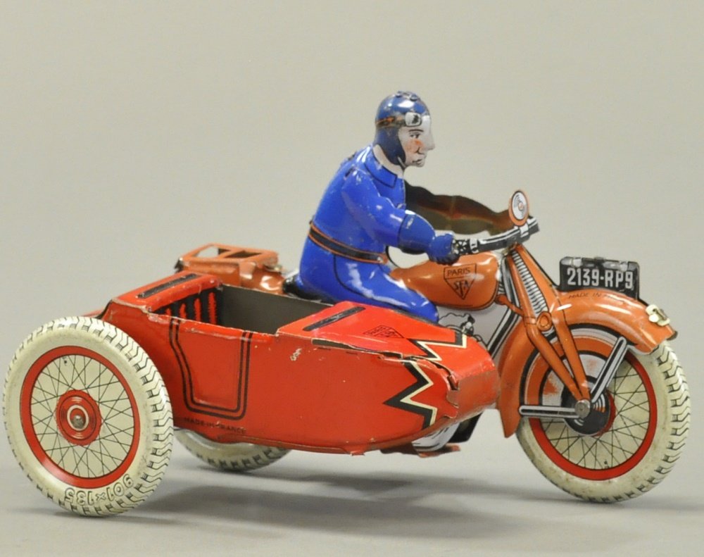 SFA CYCLE WITH SIDECAR: France, lithographed tin, civilian rider in blue outfit, features lithographed sidecar, luggage rack on rear of cycle, wind-up action. 7" l.