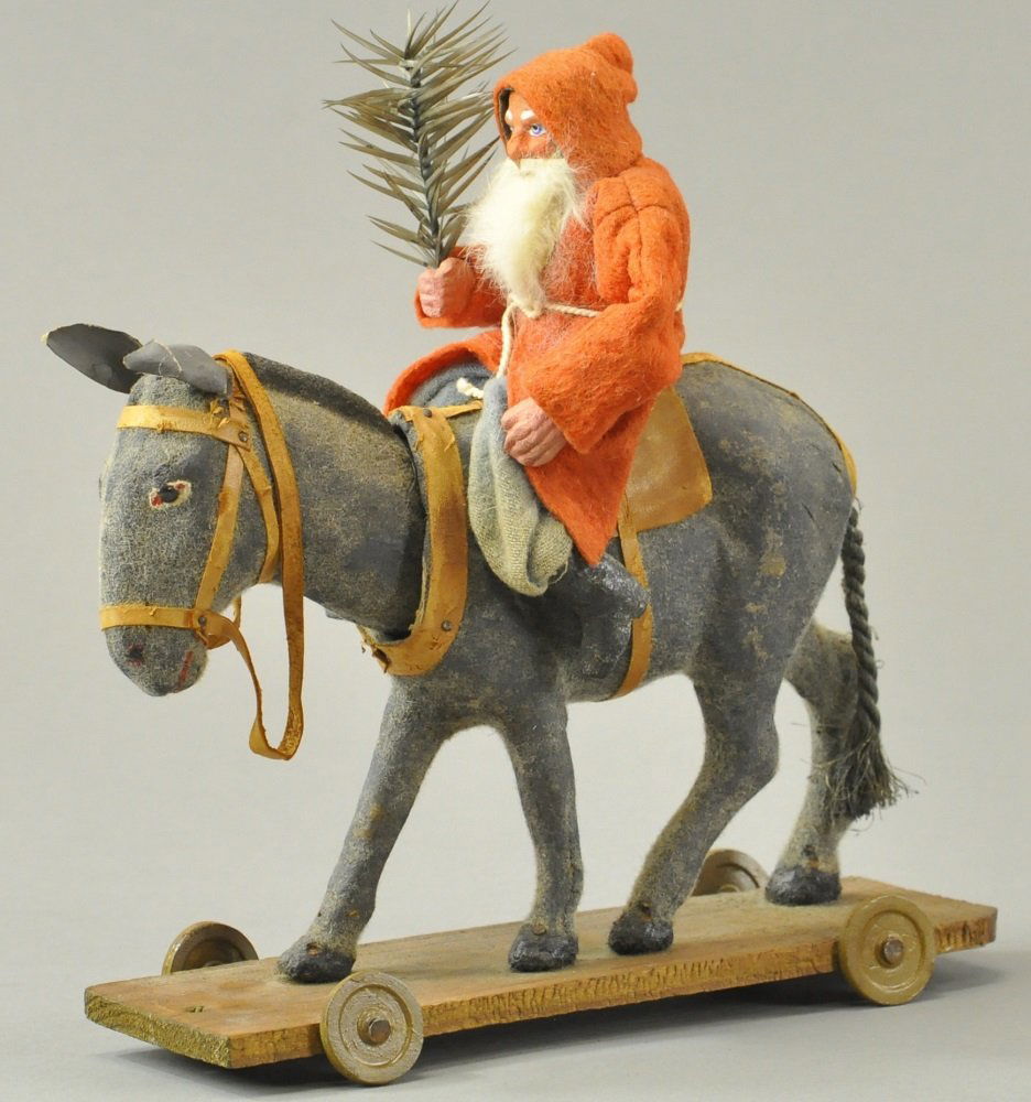 RED ROBE SANTA ON NODDING DONKEY (1 of 3)