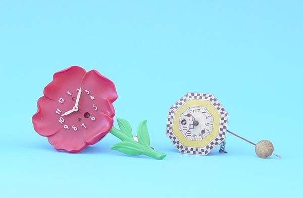 Two Small Lux Pendulette Wall Clocks: Circa 1940 American Various 30 Hour Wall Clock with " Good original dials, Spring driven brass time only movements, Photographed from left to right; A: Lux plastic petunia pendulette B: Lux retro deco